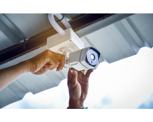 Indian Electrician Installing CCTV Security Camera - AK Enterprises CCTV Installation Services Mumbai